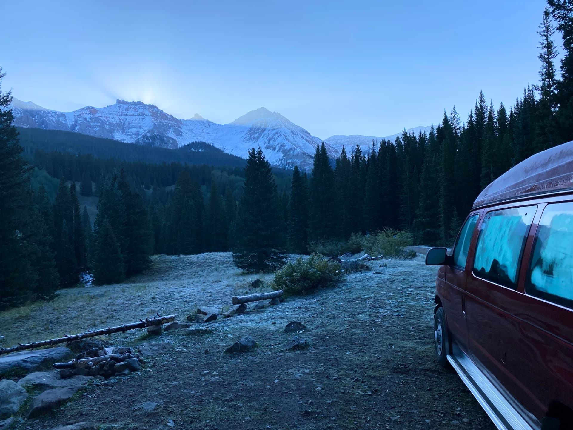 Sun rising behind mountain range